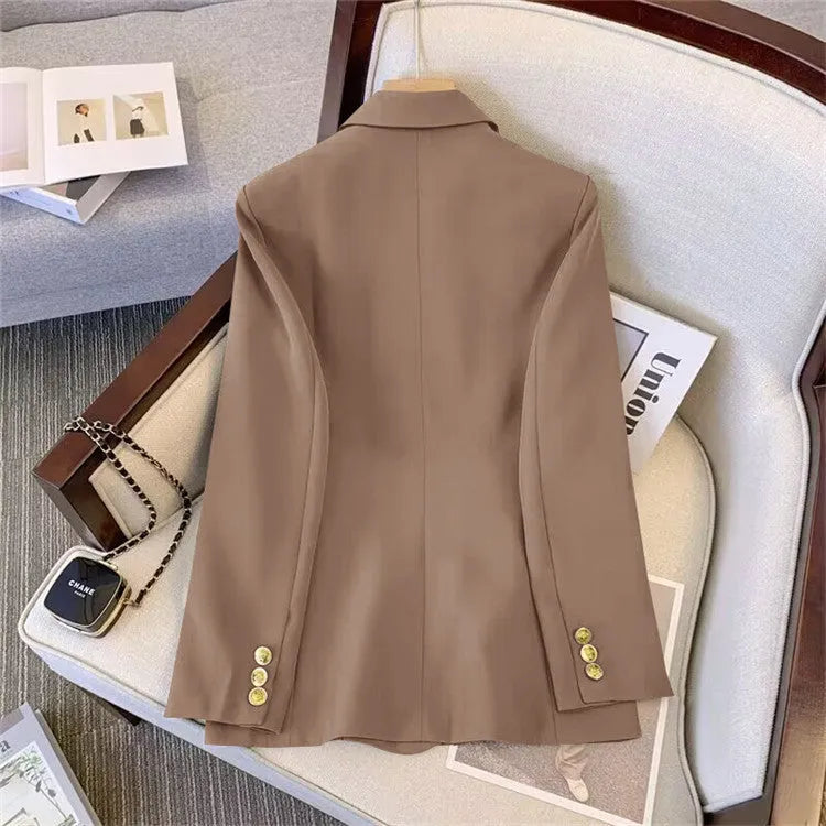 A loose-fit women's blouse in polyester fabric, shown in a neutral colour with a V-neck and regular sleeves.