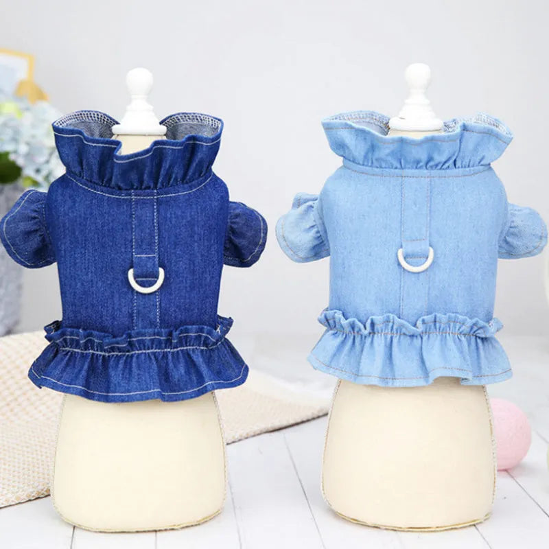 Blue denim dress for a dog or cat with ruffles and a metal leash hook on the chest.