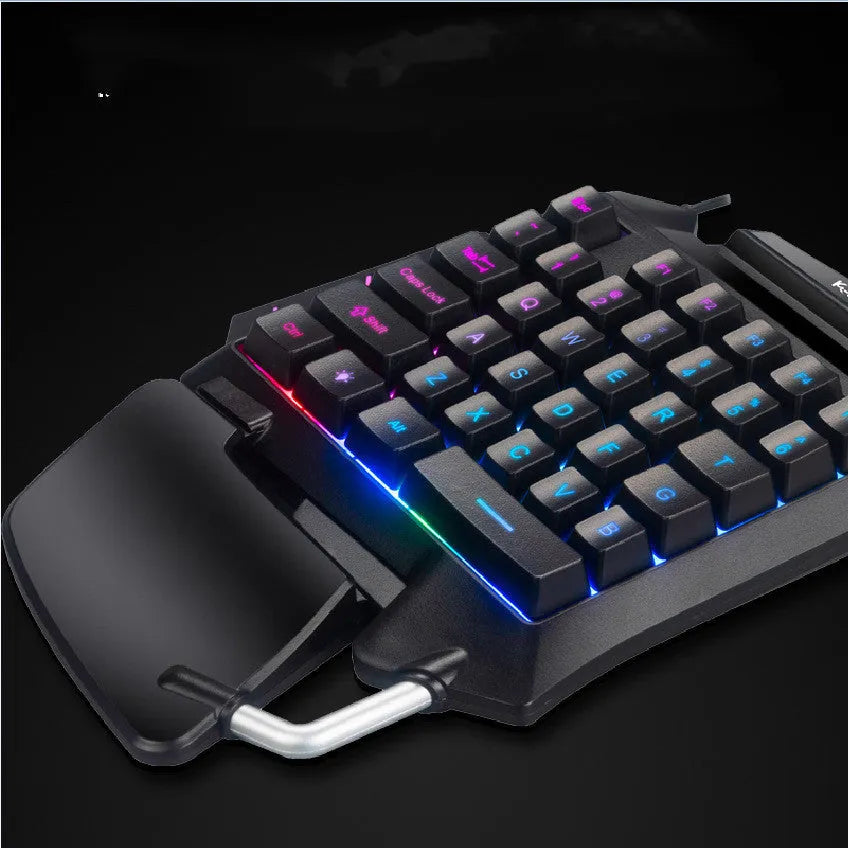 Black left-handed one-handed gaming keyboard with Throne converter and integrated hand rest for desktop PUBG gameplay