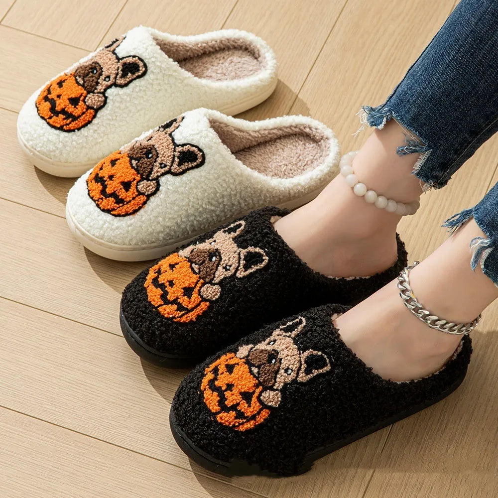 Halloween pumpkin design plush slippers with TPR rubber soles in white or black.
