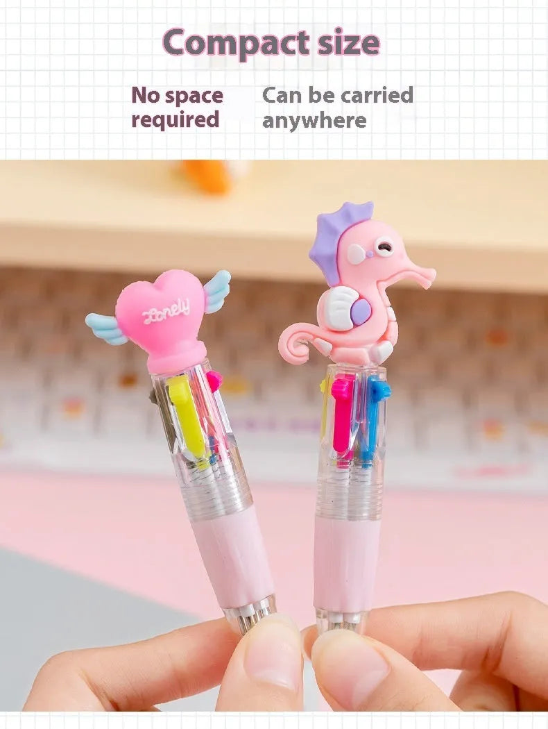 Cute cartoon four-colour press ballpoint pen with silicone grip and 0.7mm tip on a notepad.