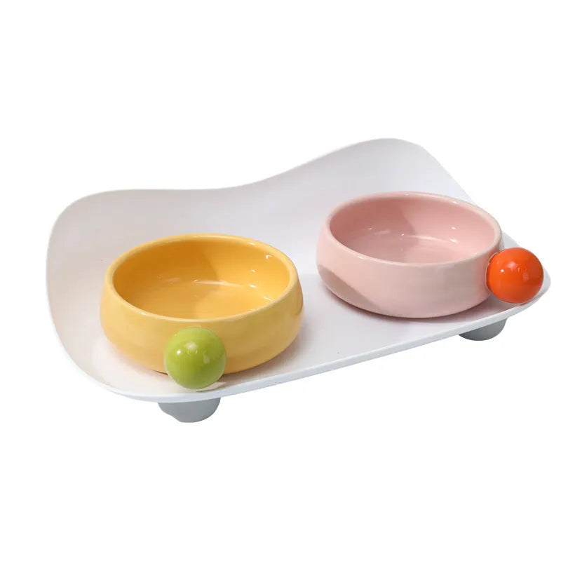 Elevated ceramic double bowl set for pets in pink, yellow or pink yellow with non-slip base
