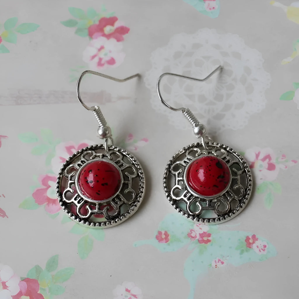 Miao ethnic silver earrings with geometric flower disk design and turquoise accents