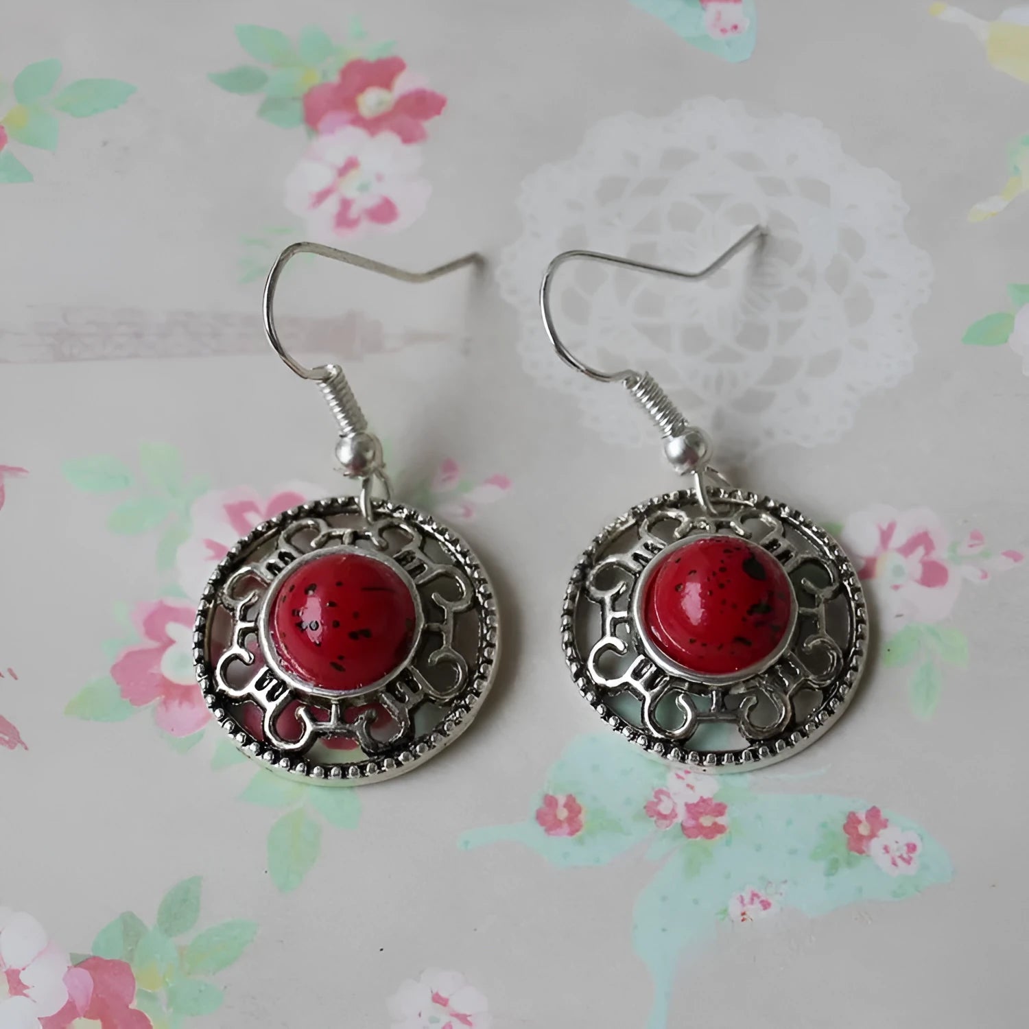 Miao ethnic silver earrings with geometric flower disk design and turquoise accents