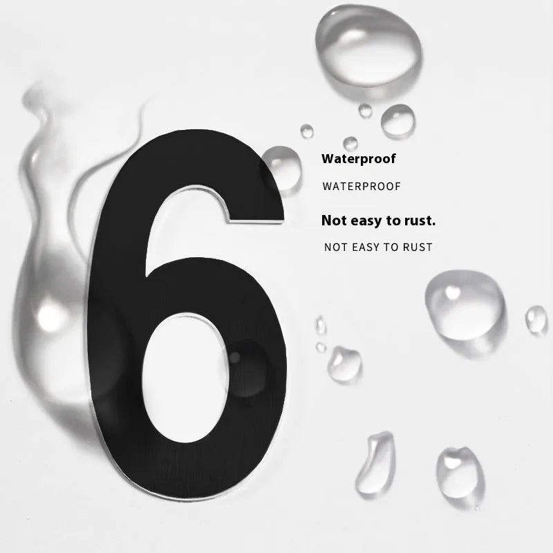 Black stainless steel sticky house number 7.5cm tall with self-adhesive backing.