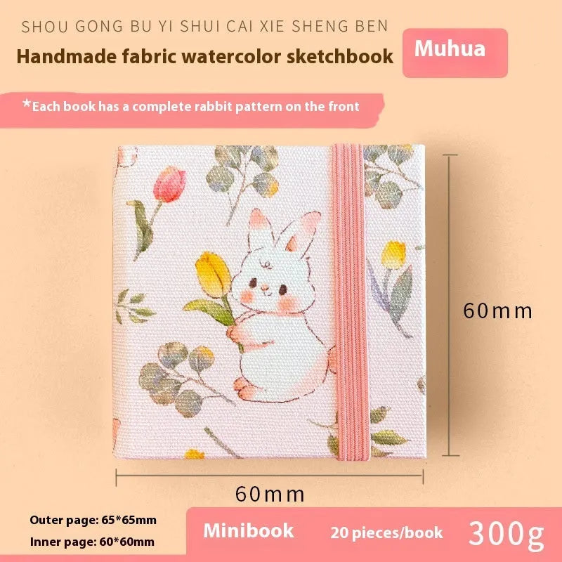 Feiluniao handmade fabric watercolour notebook in 185mm portable size, showing artistic cover design.