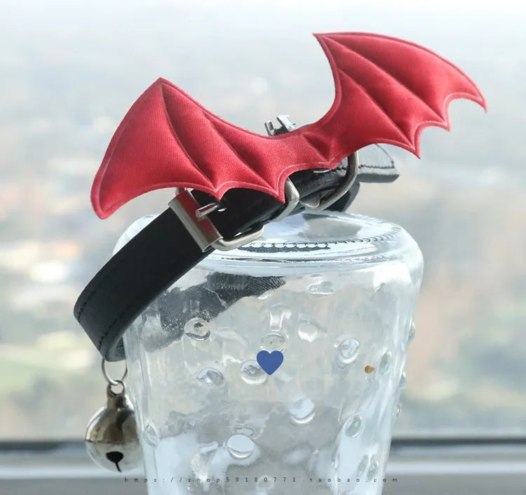 Small dog collar with devil wings and bell detail in patent leather satin material