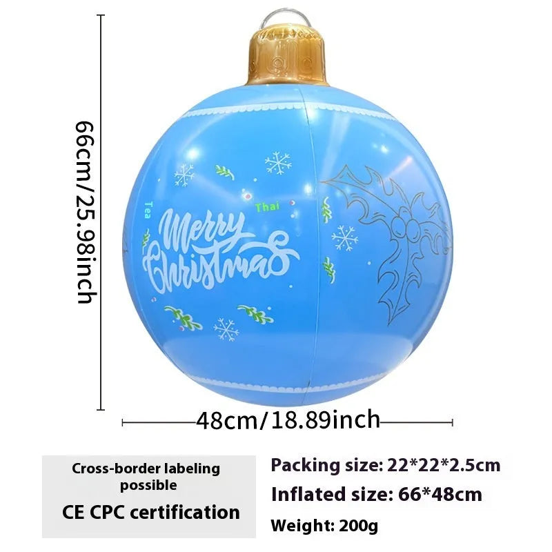 Large red and white inflatable Christmas ball with flashing lights in a garden setting.