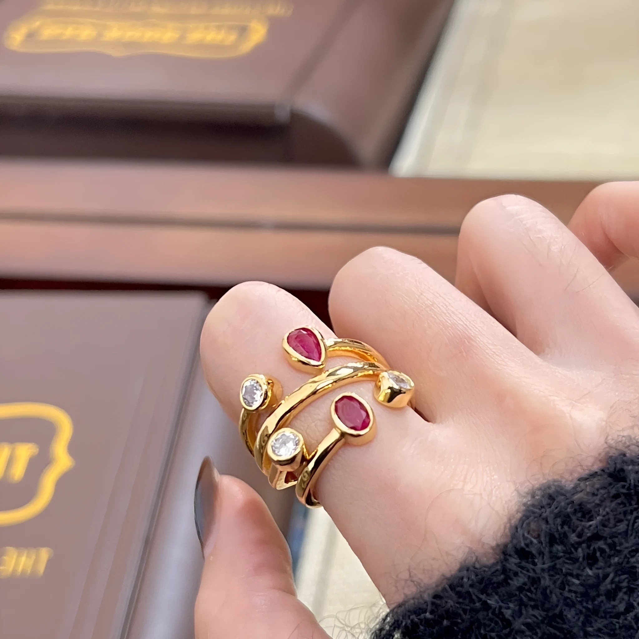 Retro geometric copper ring with irregular cross shape and two-tone colour.
