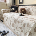 Retro floral chenille sofa cover in beige draped over a sofa, 180cm width, with fabric texture visible