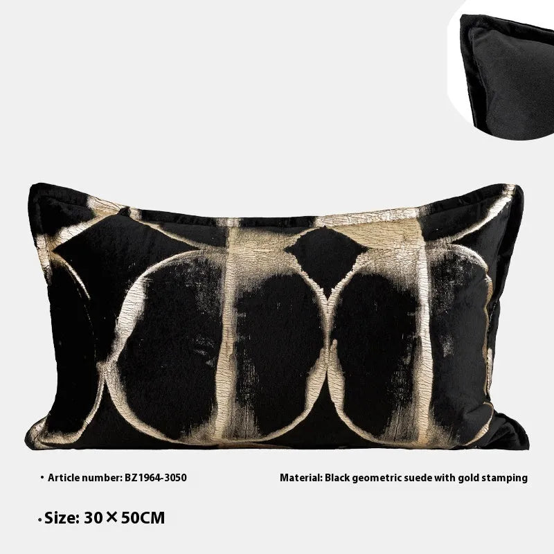 Black gold abstract pattern flannel cushion pillow in square and rectangular sizes on a sofa.