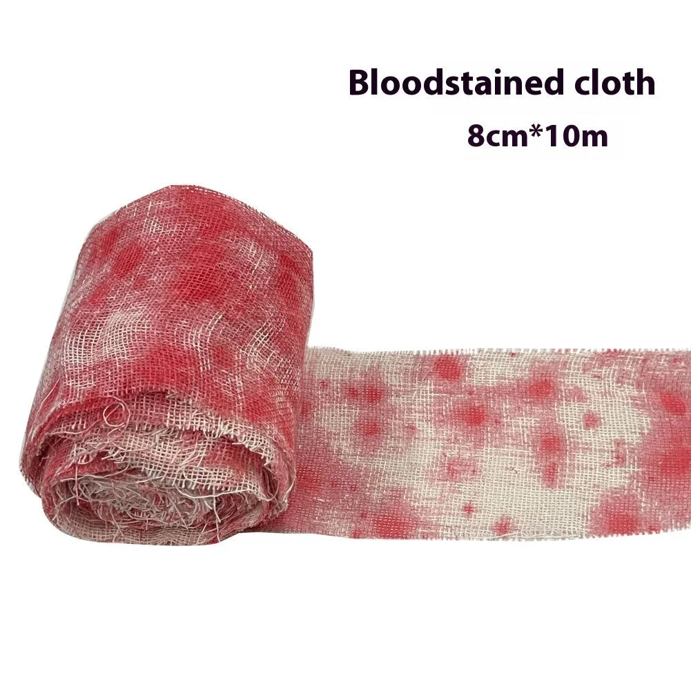 Roll of Halloween horror bandage in bloody red colour with a frayed end, showing its 8cm width and cloth-like polyester texture.