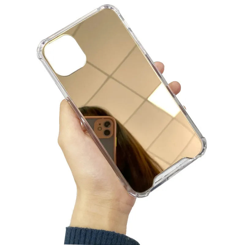 Silver mirror finish hard PC phone case for Apple iPhone on a table.