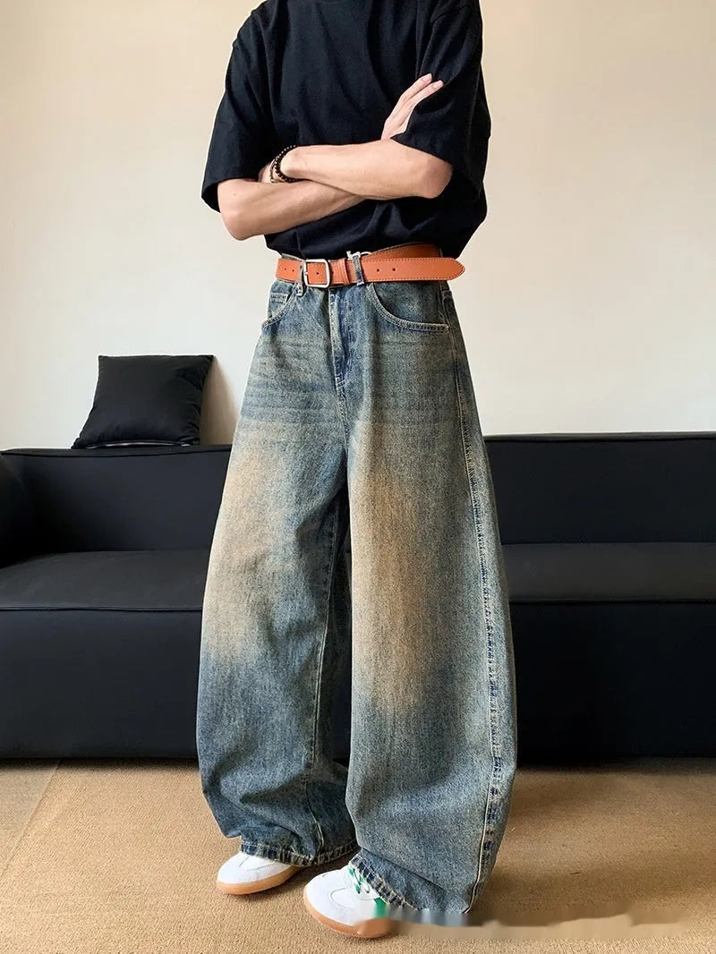 Men's retro blue wide-leg jeans with distressed detailing and machete wash effect