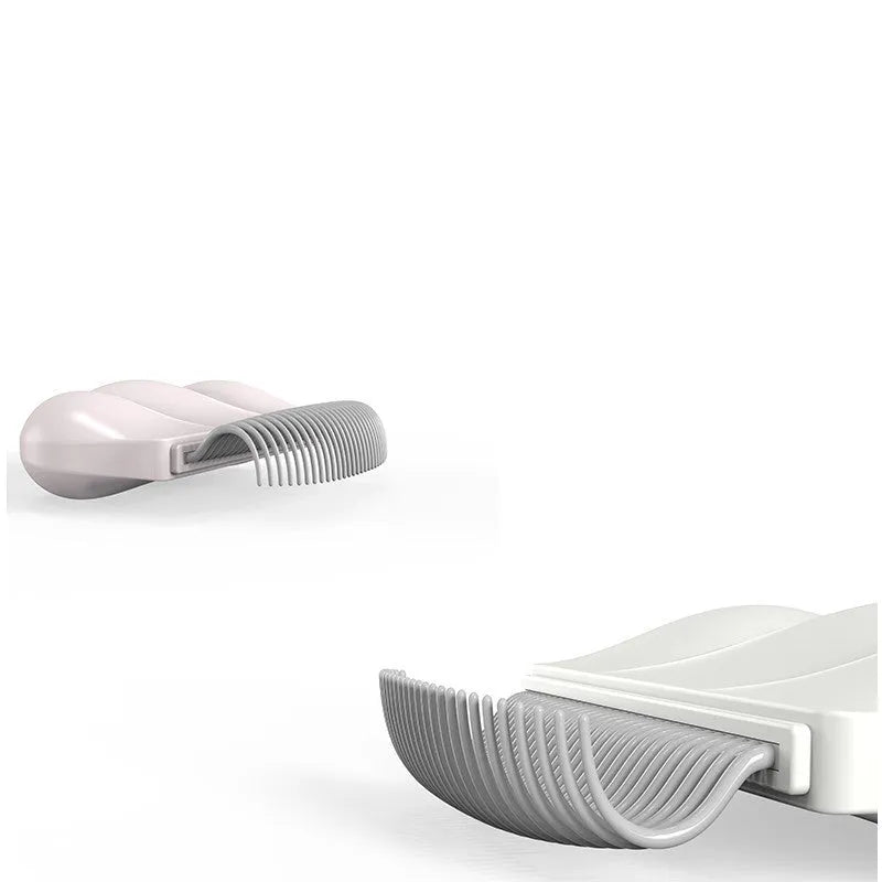 Blue soft silicone pet deshedding brush for cats and dogs on a white background
