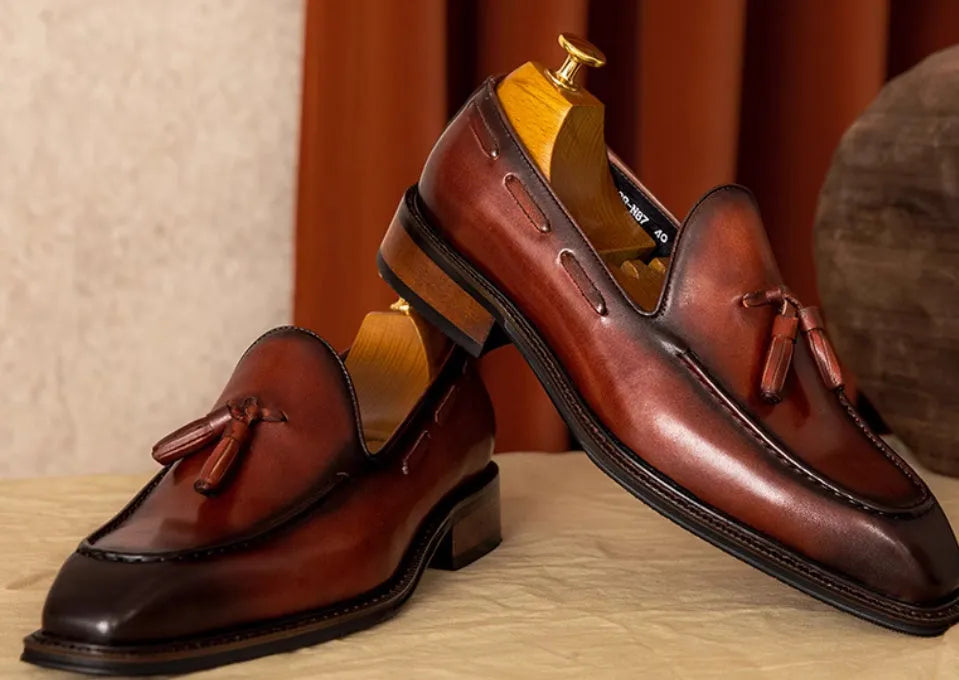 Men's black genuine leather loafers with fringed British styling and slip-on design