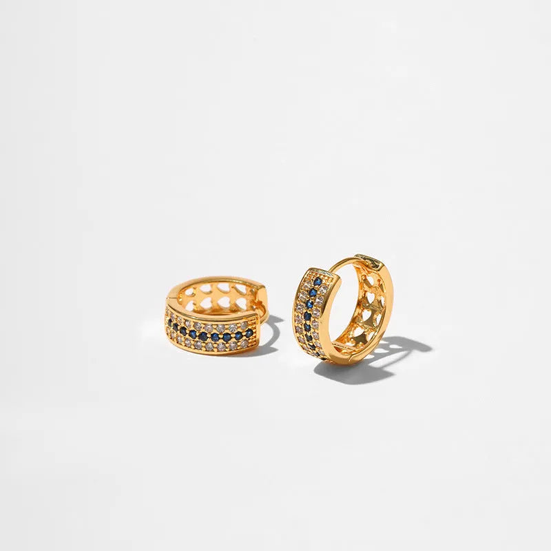 Geometric round women's post earrings with a gold electroplated finish on a copper base.