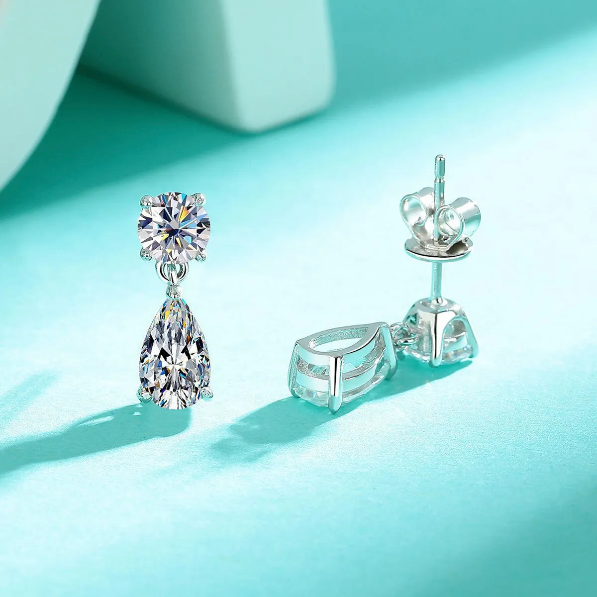 Water drop moissanite stud earrings in sterling silver with geometric shapes and gold/silver plating options