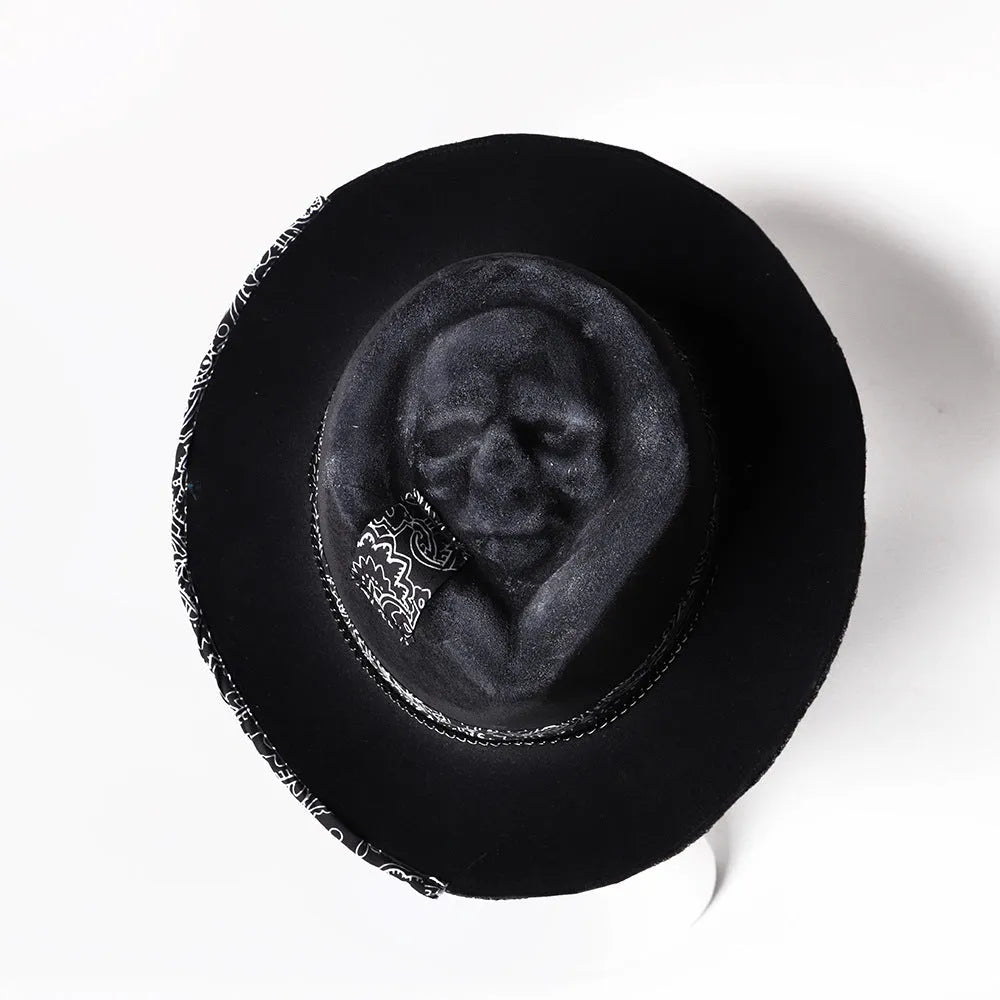 Handmade wool felt Halloween hat with conical crown and skull print, featuring denim fabric accents