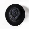 Handmade wool felt Halloween hat with conical crown and skull print, featuring denim fabric accents