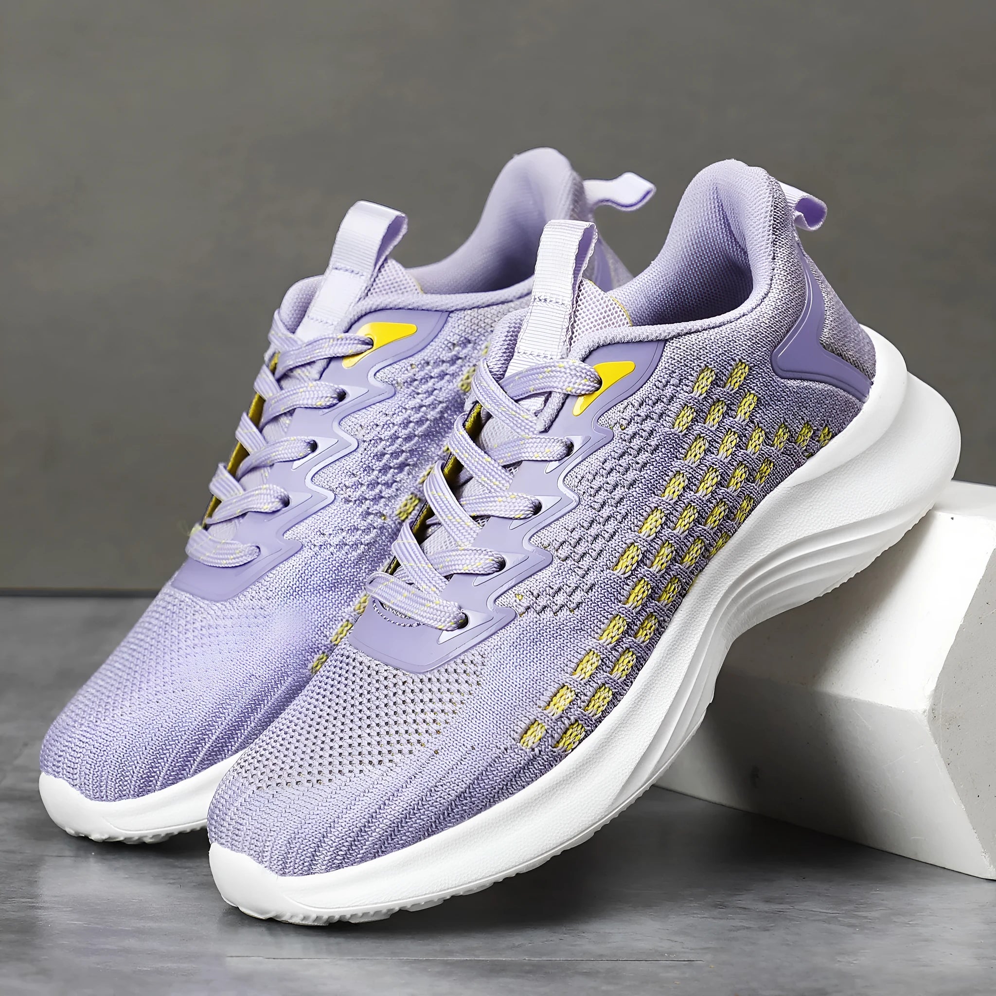 Women's Lavender Purple Flyknit running shoes with striped pattern and mesh lining on white background