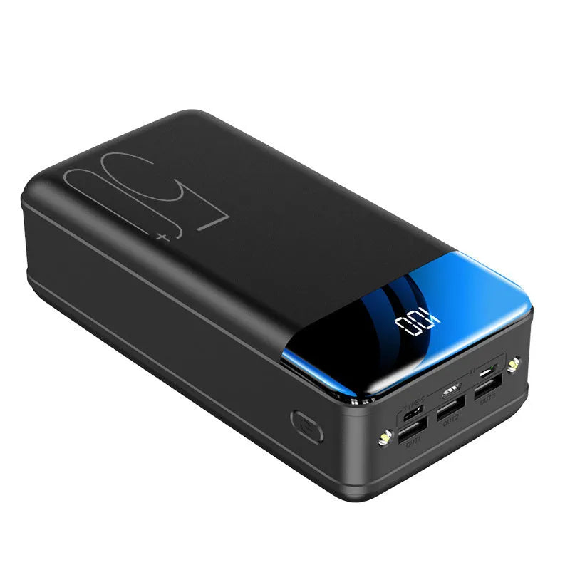 Black and white large capacity 50000mAh power bank with multiple USB ports for charging.