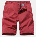 Man wearing blue denim casual shorts with no belt, straight leg, and loose workwear fit