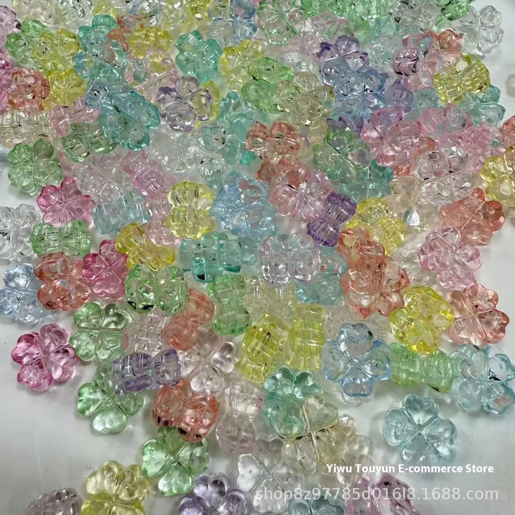 High transparency acrylic fat clover camellia beads scattered on white surface