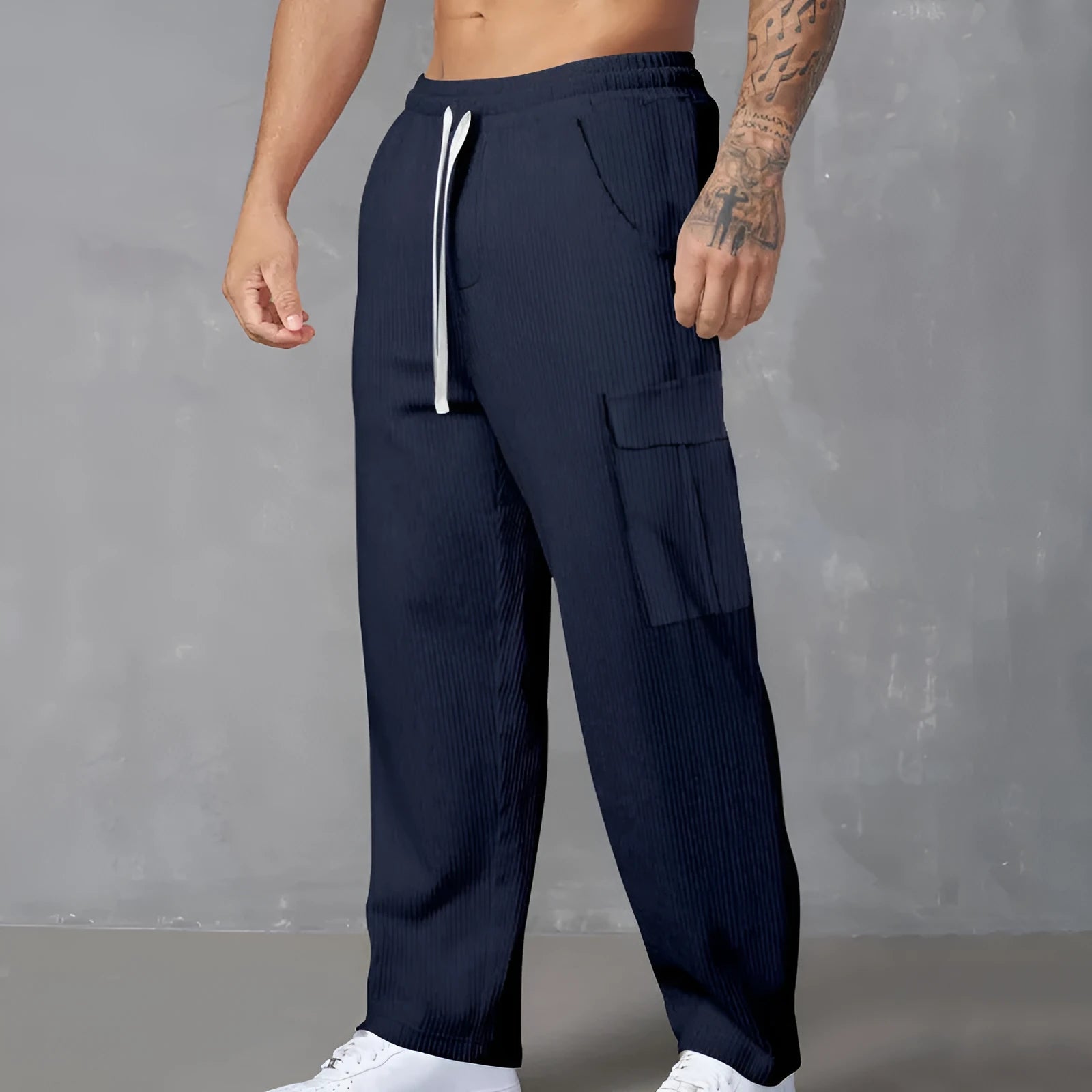 Men's corduroy cargo trousers in loose fit wide-leg design with elastic waist