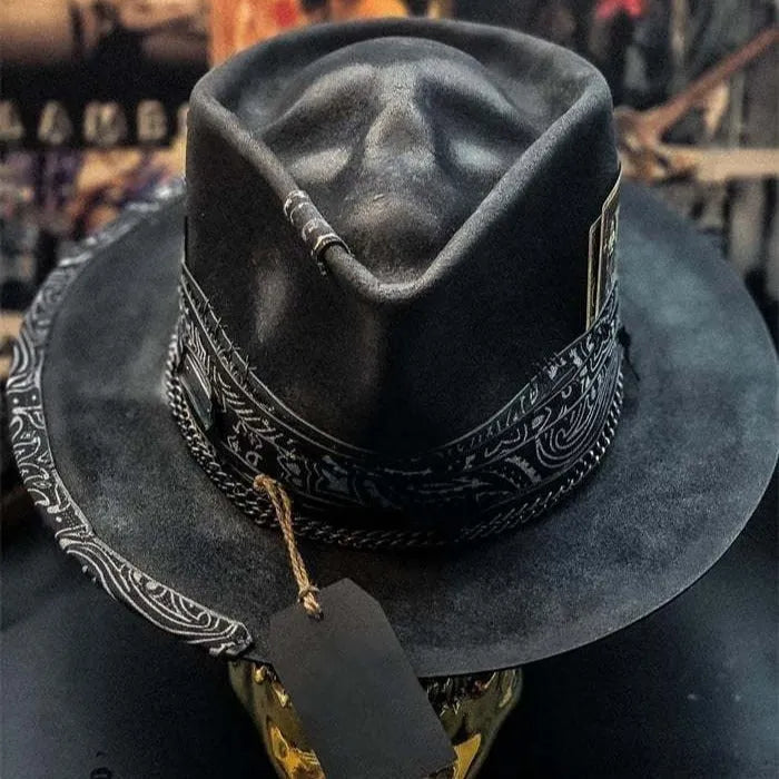 Handmade wool felt Halloween hat with conical crown and skull print, featuring denim fabric accents