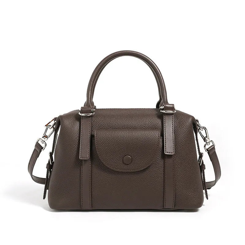 Genuine leather street trend handbag with lock detail and contrast stitching in 27x12x20 cm size