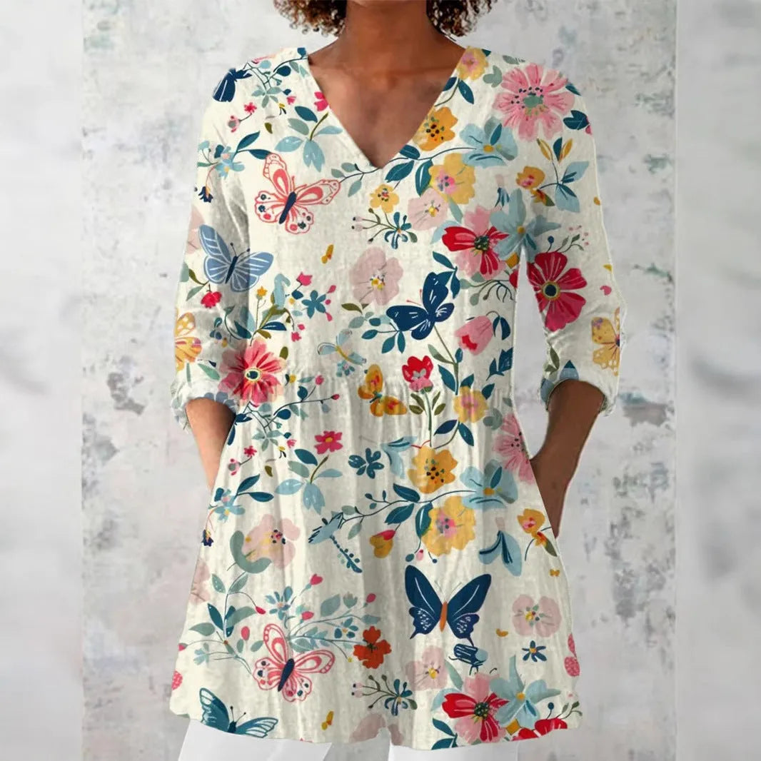 Women's retro-style slim fit long-sleeved top with a digital print pattern, shown on a hanger.