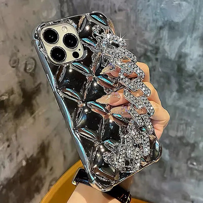 Luxury diamond bracelet design iPhone case in gold and silver colours with chain detail.