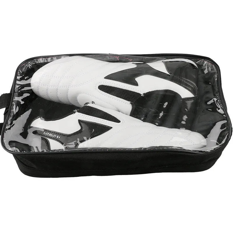 Black and white children's Sanda martial arts training shoes with a soft sole, shown with a shoe bag and socks.