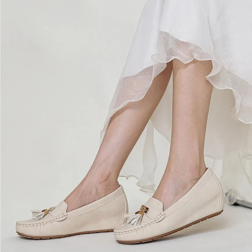 Nude-coloured height increasing shoe insole with round toe and TPR sole, shown next to a flat shoe.