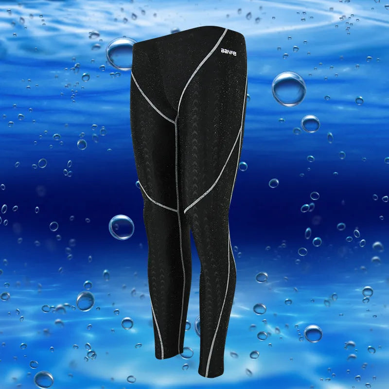 Men's black nylon cropped swimming trunks with green line detail for swimming and sports