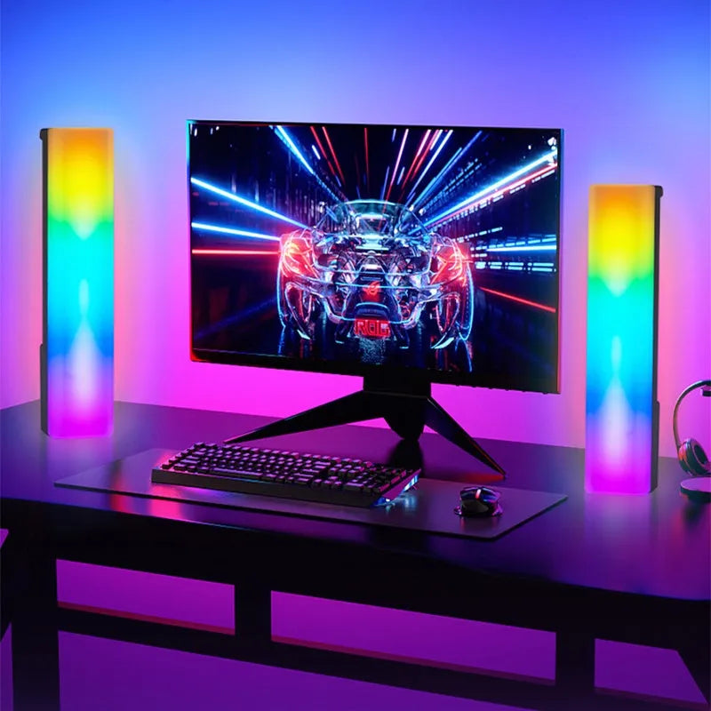 Tall 3D RGB LED ambience lamp with colourful lights on a desk, showcasing its voice-activated music rhythm mode.