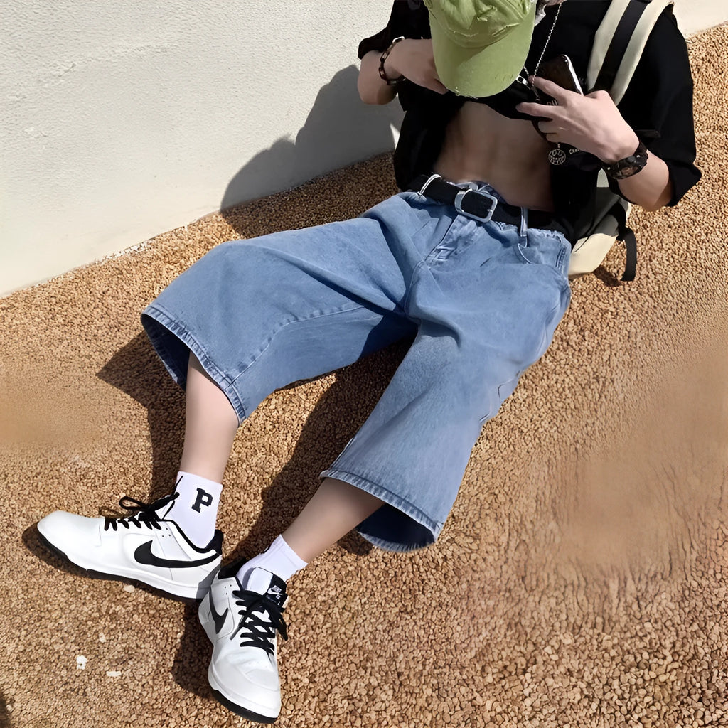 Men's blue washed denim pirate shorts with a high waist and cropped, straight leg.