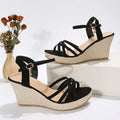 Women's beige wedge sandals with fish mouth toe and cloth upper, shown on a white background