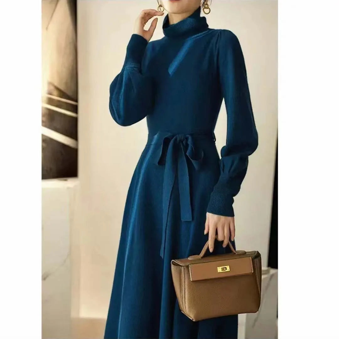 Rose red knit dress with a turtleneck collar, long sleeves, an elastic waist, and a loose big-hemmed midi skirt.