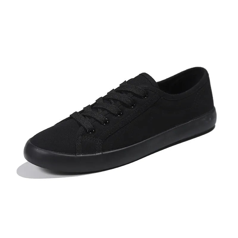 All black Korean style canvas flat work shoes for women with front lace-up and rubber sole