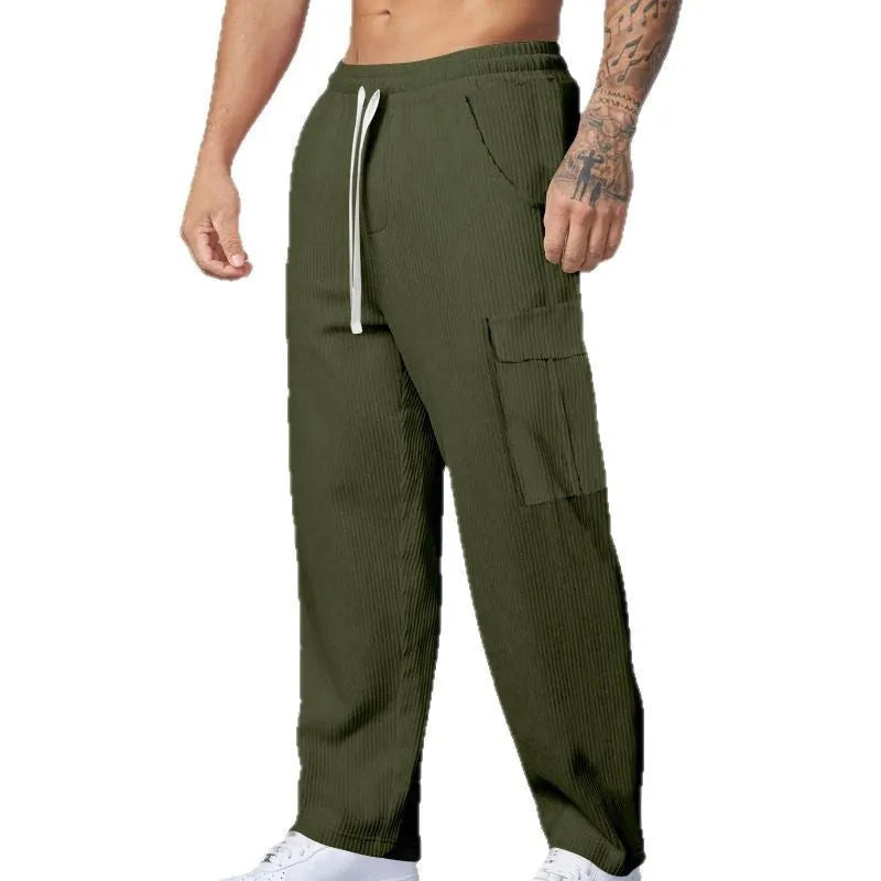 Men's corduroy cargo trousers in loose fit wide-leg design with elastic waist