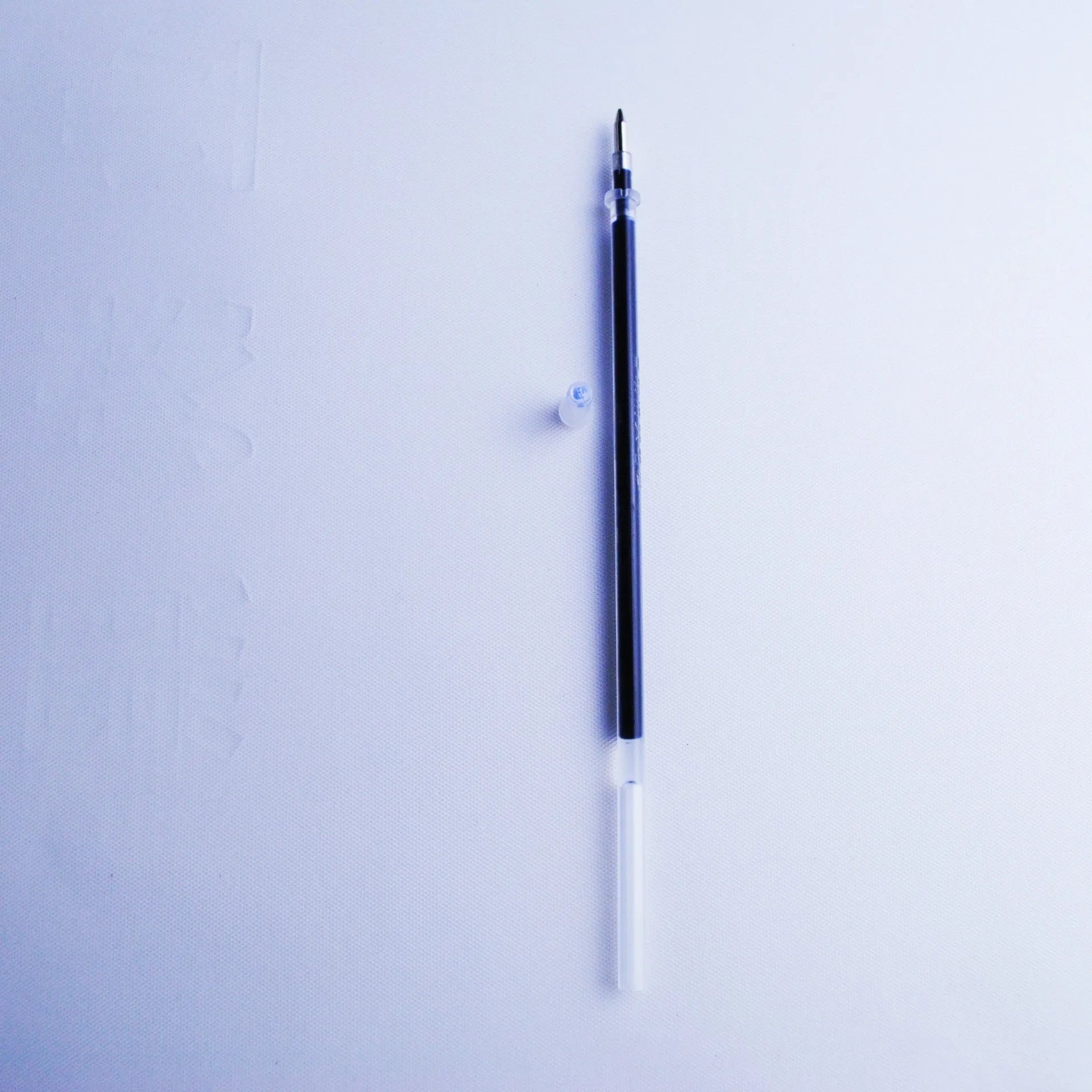 Pack of eight blue 0.5mm pen refill cores with insertion pole and holder for simple series pens.