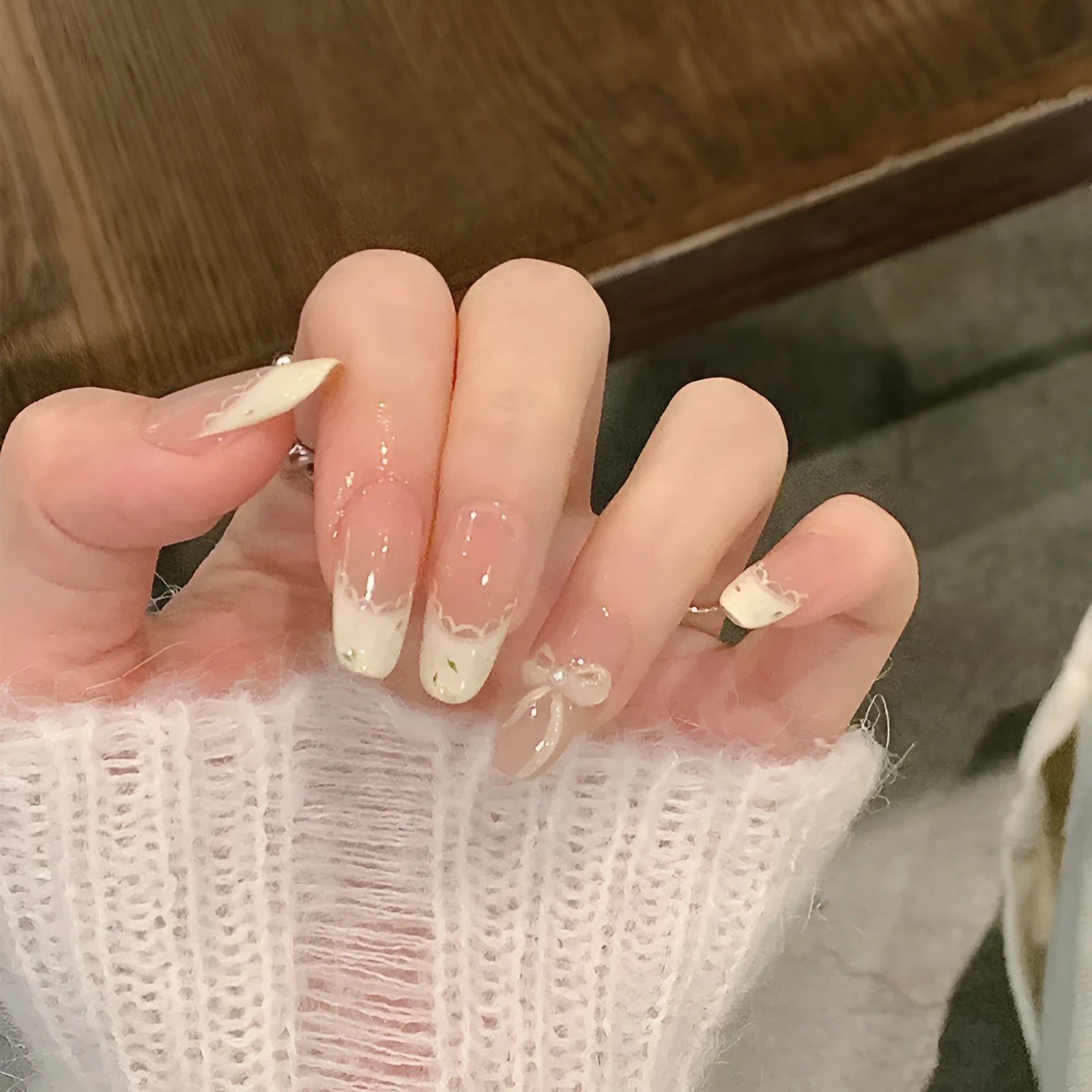Set of colourful artificial false nails with glitter designs for DIY manicures.