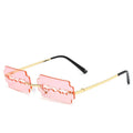 Women's metal rimless frameless sunglasses with gold frame and blue lens on display