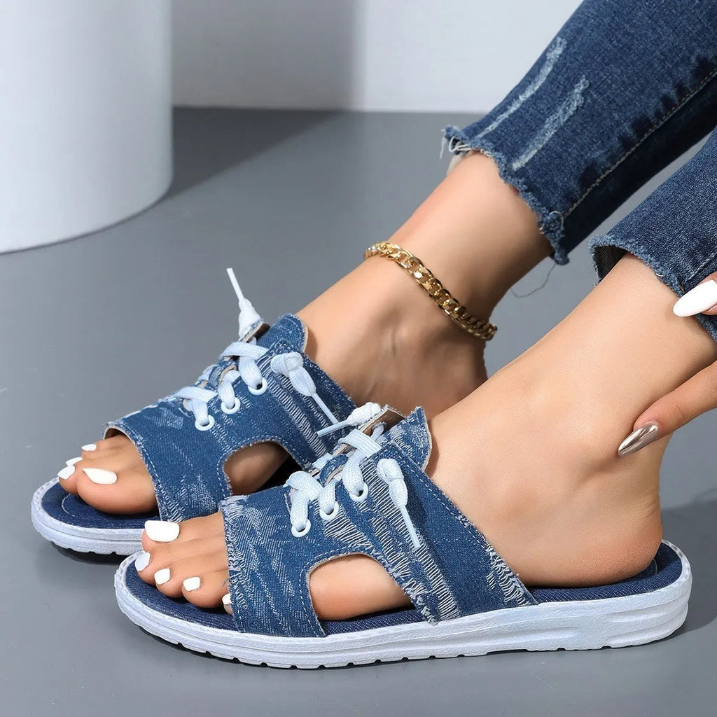 Blue canvas Roman-style slippers for women with a rubber sole.