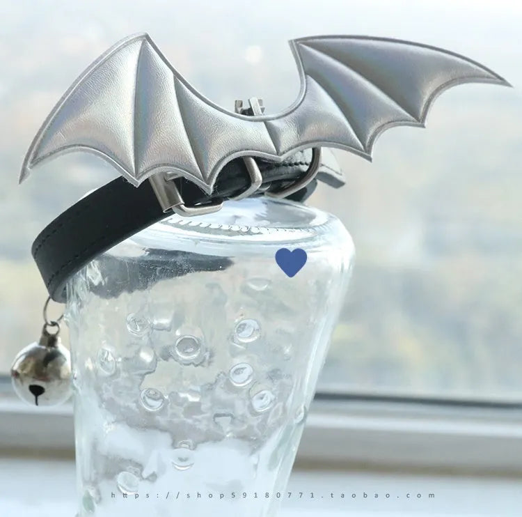 Small dog collar with devil wings and bell detail in patent leather satin material
