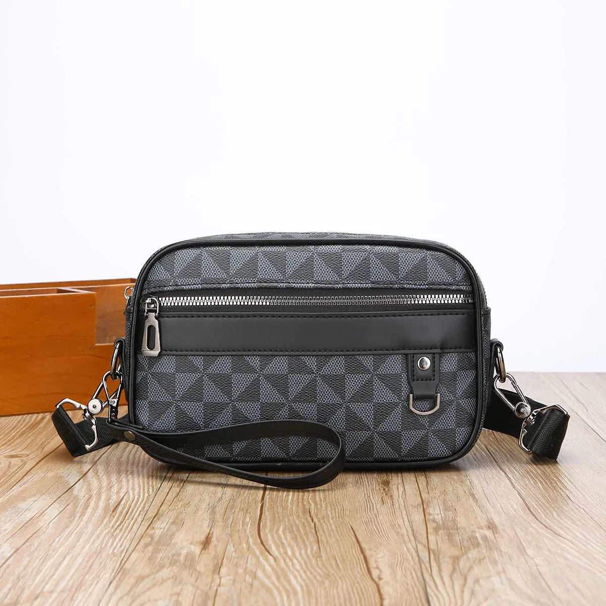 Men's black geometric pattern PU messenger bag with a shoulder strap, shown horizontally.