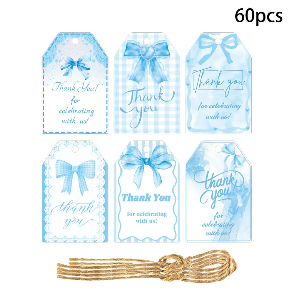 Set of 60 decorative bowknot-shaped paper gift tags with natural jute twine for birthdays.