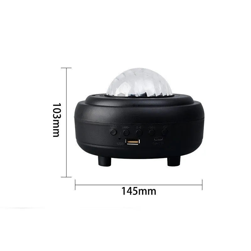 White Galaxy Star Projector Night Light showing star projection on wall next to a smartphone